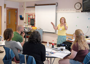 Master teacher Carolyn Bereska discusses teaching strategies with educators at NSA's 2010 summer math institute. (Photo credit: National Security Agency)